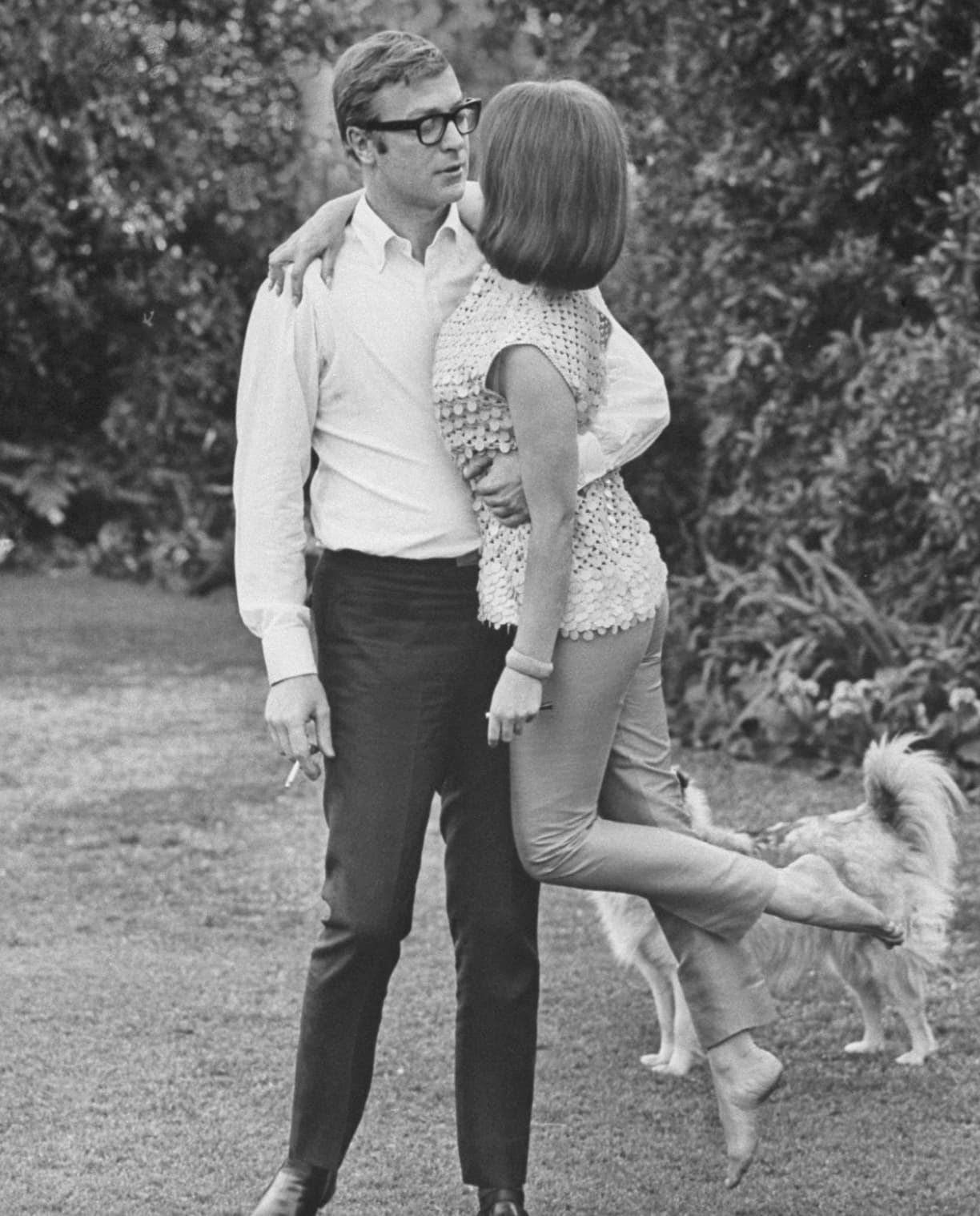 “Michael Caine sweeping Natalie Wood off her feet, 1966.”